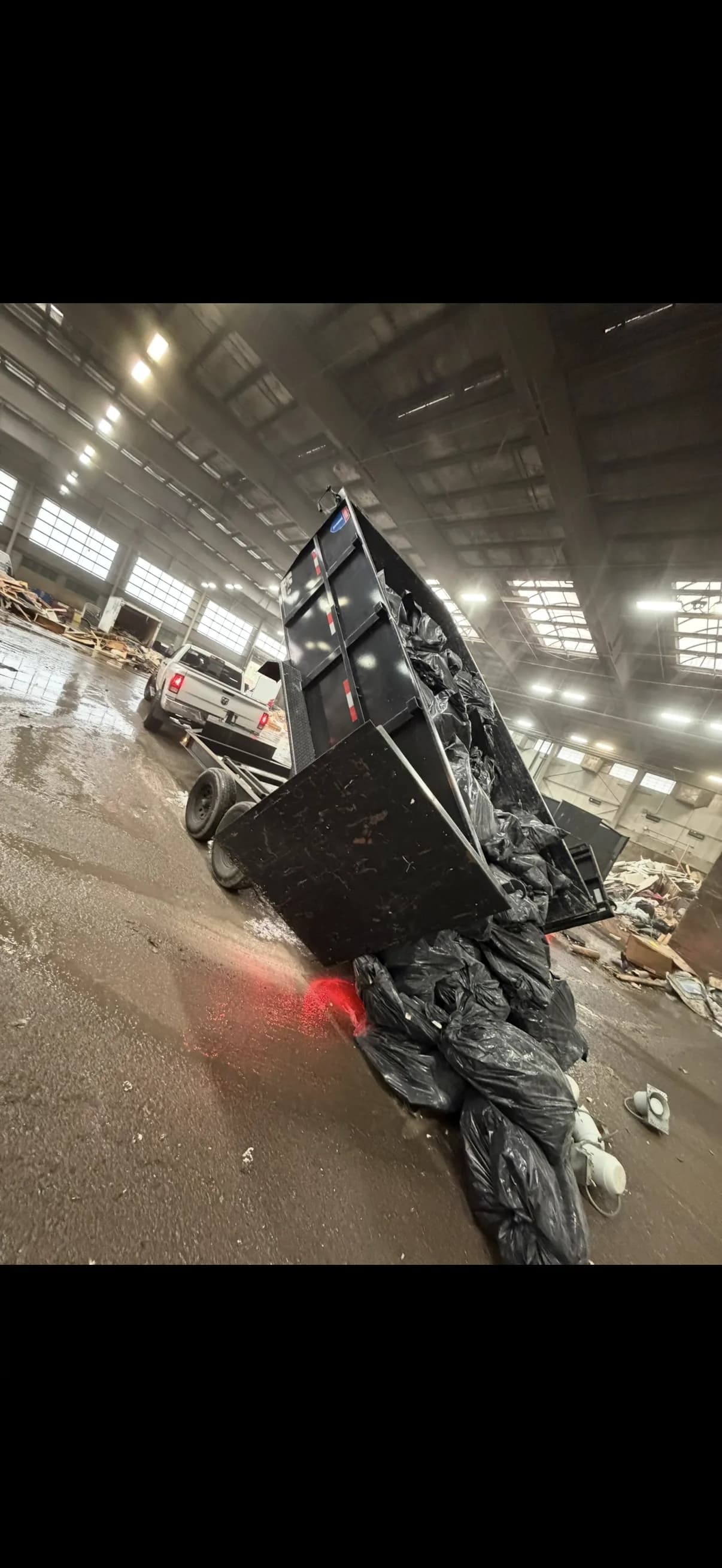 Open trailer loaded with junk and debris for transport