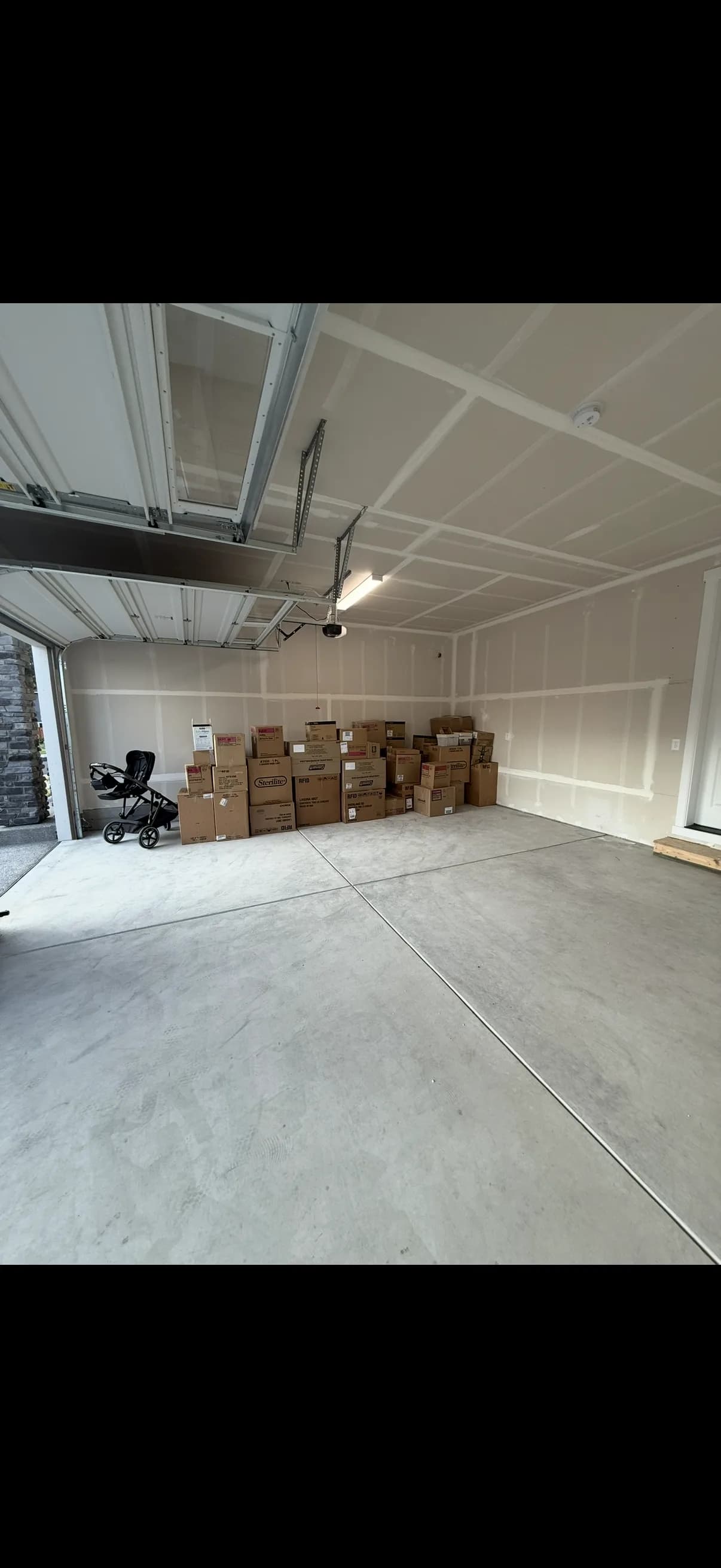 Cluttered garage packed with items before cleanout