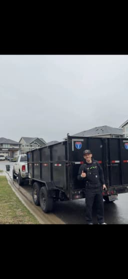 Top Tier owner standing beside trailer on a residential street